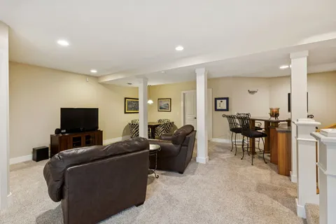 a backyard of a house with lots of green space and fountain