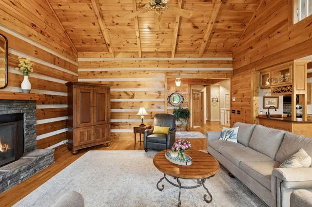 a dining room with furniture wooden floor and a rug