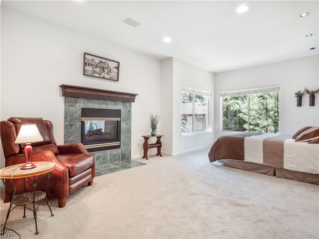 1368 Zurich Lane Incline Village, NV 89451 - Photo 21 of 34 a bedroom with furniture and a fireplace