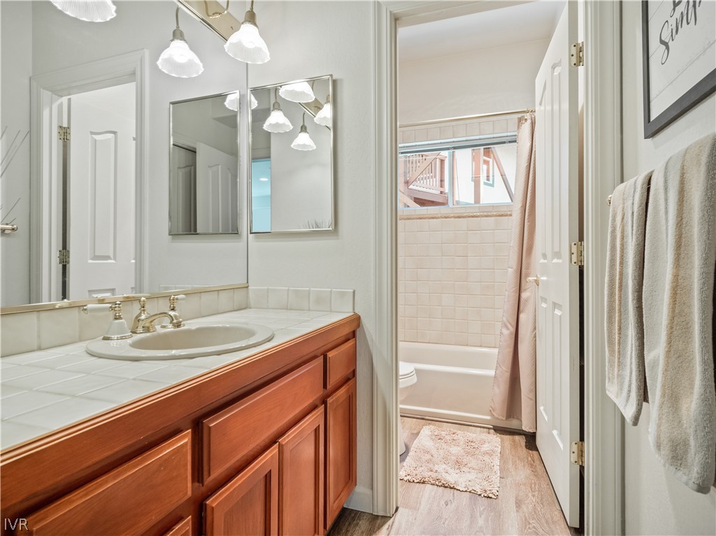 1368 Zurich Lane Incline Village, NV 89451 - Photo 26 of 34 a bathroom with a granite countertop sink a toilet and a mirror