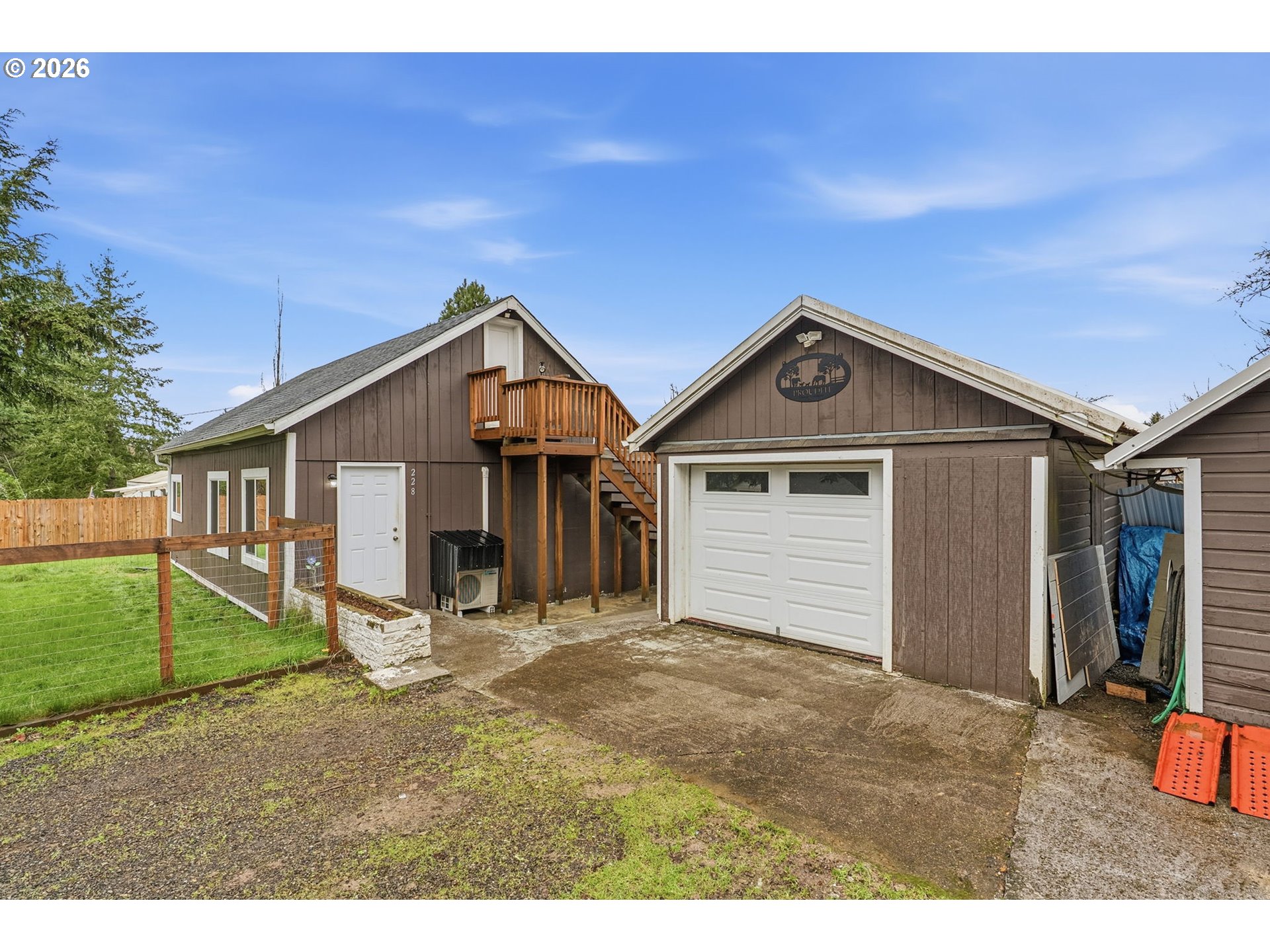 228 Holcomb Spur Road Kelso, WA 98626 - Photo 1 of 23 a view of a house with a yard and large tree
