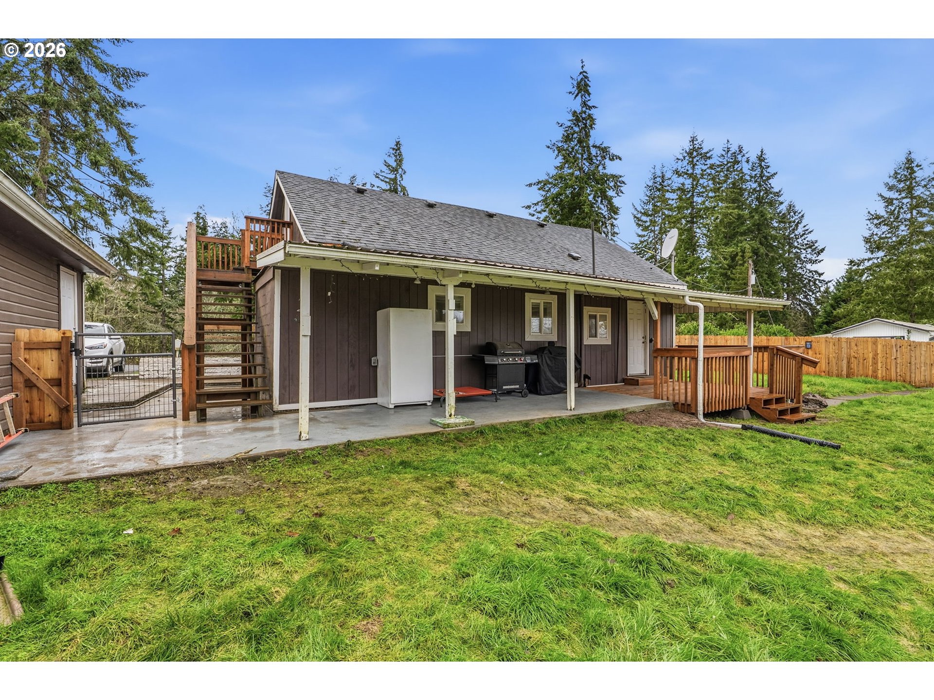 228 Holcomb Spur Road Kelso, WA 98626 - Photo 17 of 23 a view of a house with backyard porch and furniture