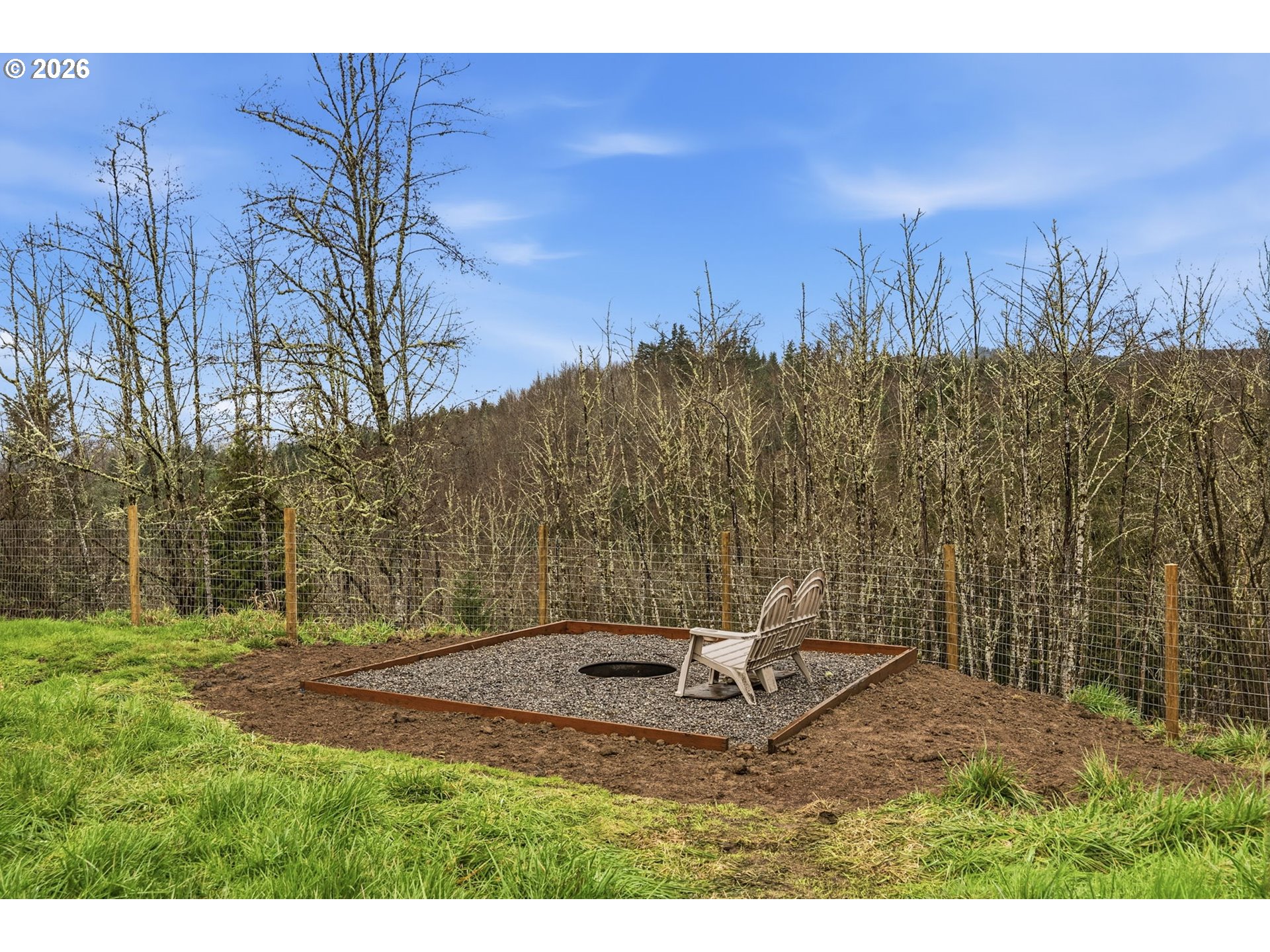 228 Holcomb Spur Road Kelso, WA 98626 - Photo 19 of 23 a backyard of a house with lots of green space
