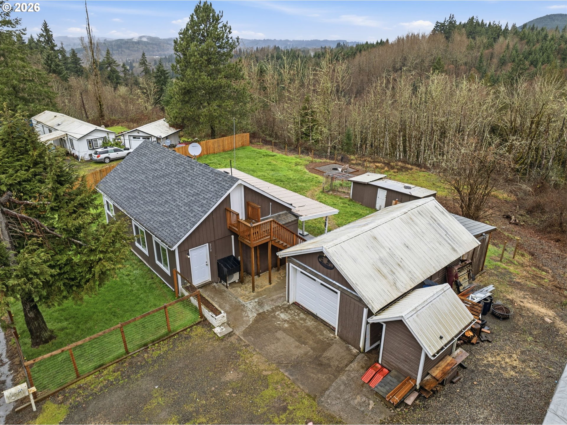 228 Holcomb Spur Road Kelso, WA 98626 - Photo 2 of 23 an aerial view of a house with a yard