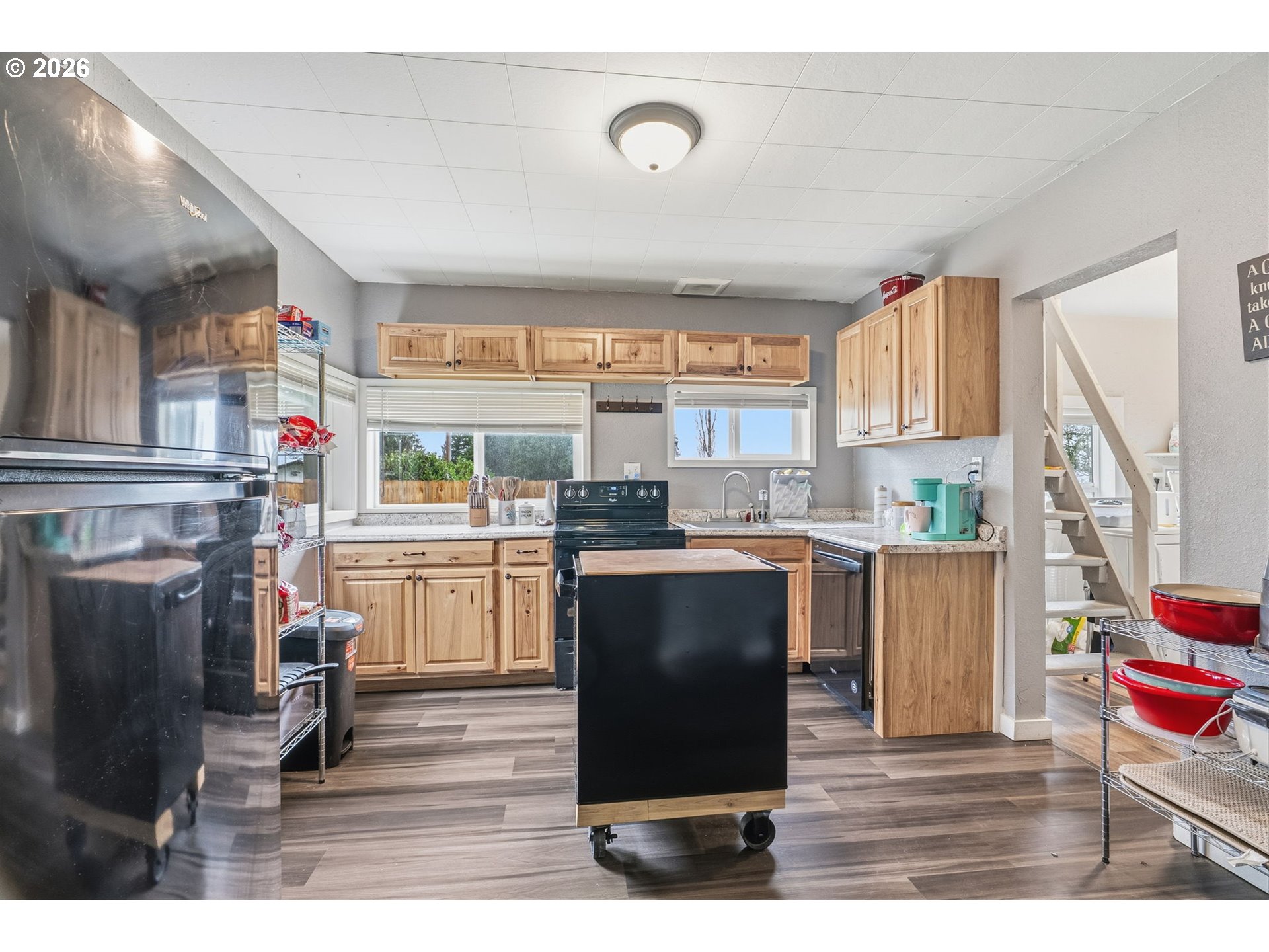 228 Holcomb Spur Road Kelso, WA 98626 - Photo 6 of 23 a kitchen with a refrigerator and a stove top oven