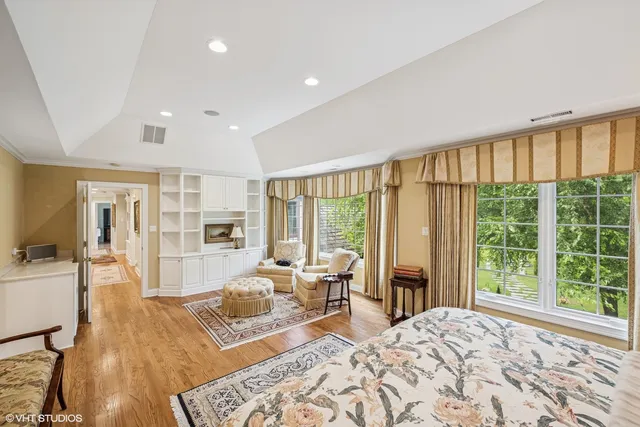 a living room with furniture and large windows