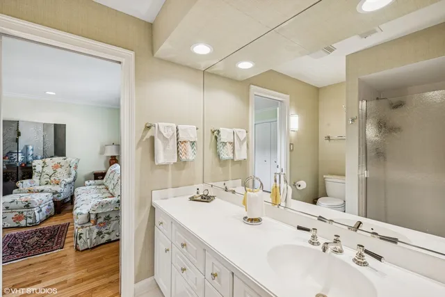 a bathroom with a double vanity sink mirror and double