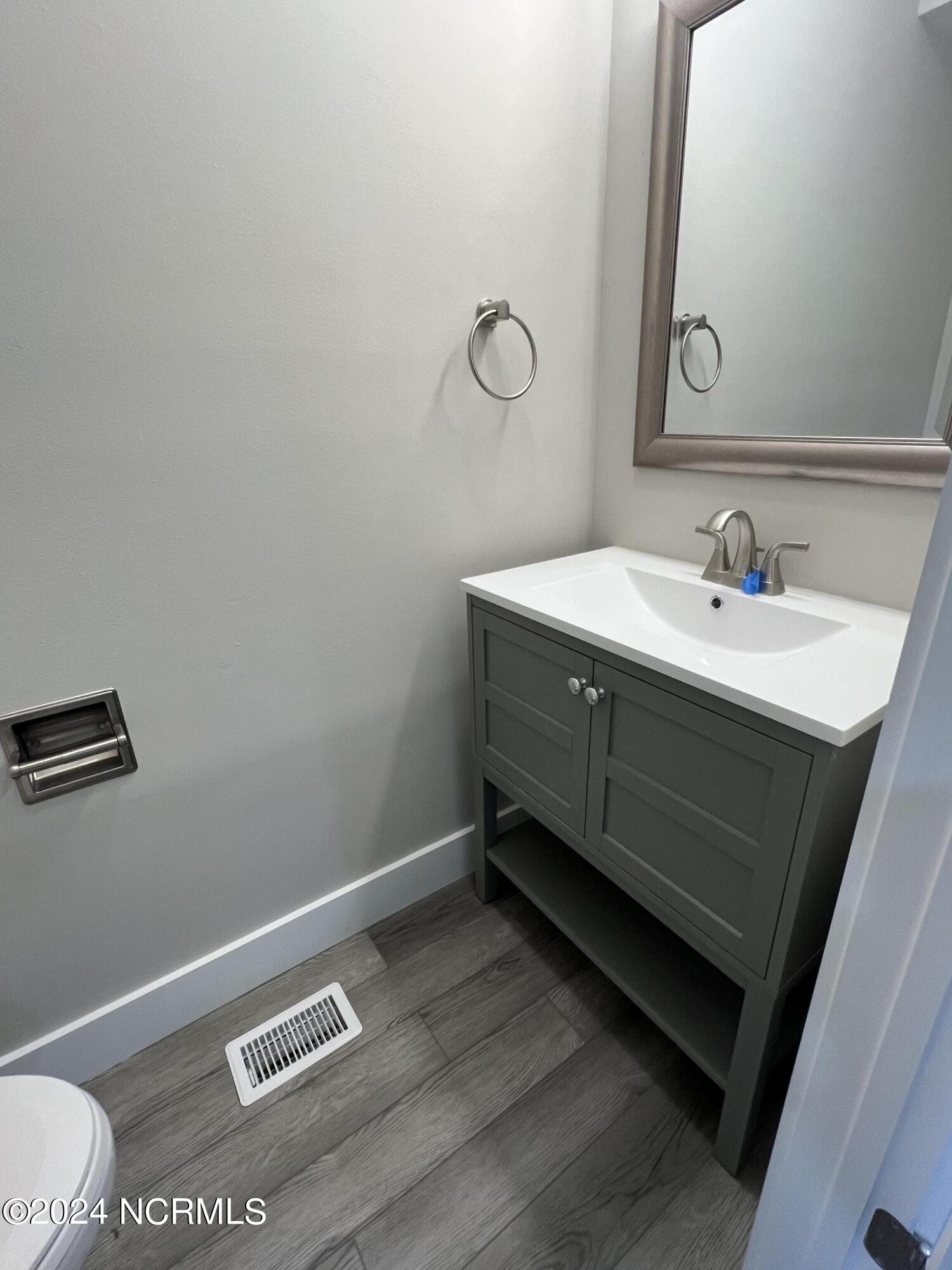 209 Bonnie Brook Road, Unit 2 Aberdeen, NC 28315 - Photo 8 of 12 Lower half bath