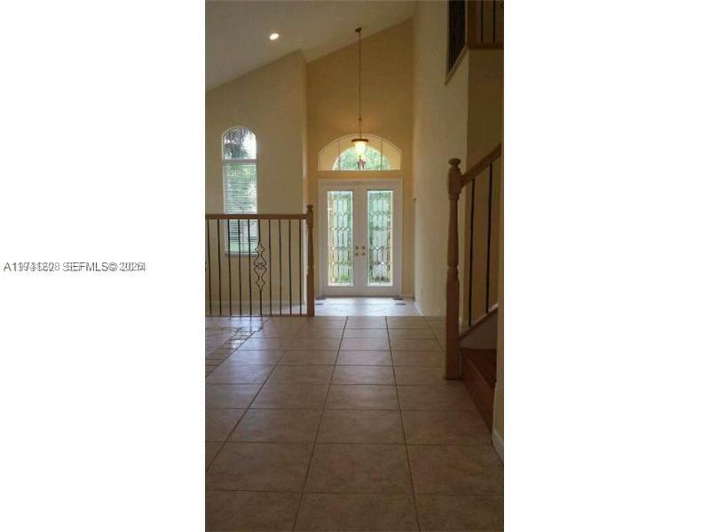15880 Southwest 50th Street Miramar, FL 33027 - Photo 2 of 8 a view of a hallway with entryway