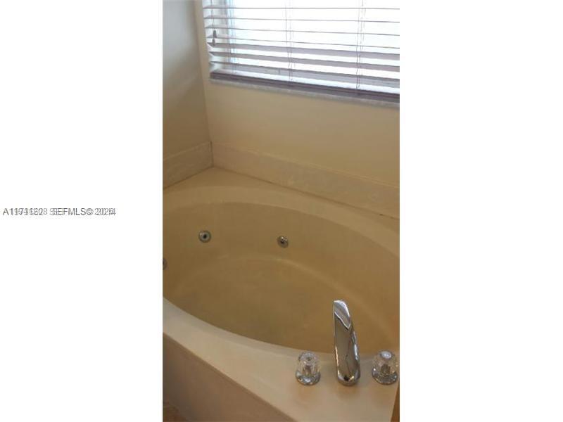 15880 Southwest 50th Street Miramar, FL 33027 - Photo 3 of 8 a bathroom with a sink