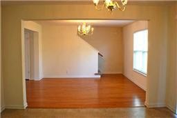 3953 Stephens Ridge Way Antioch, TN 37013 - Photo 8 of 13 a view of an empty room with wooden floor and a window