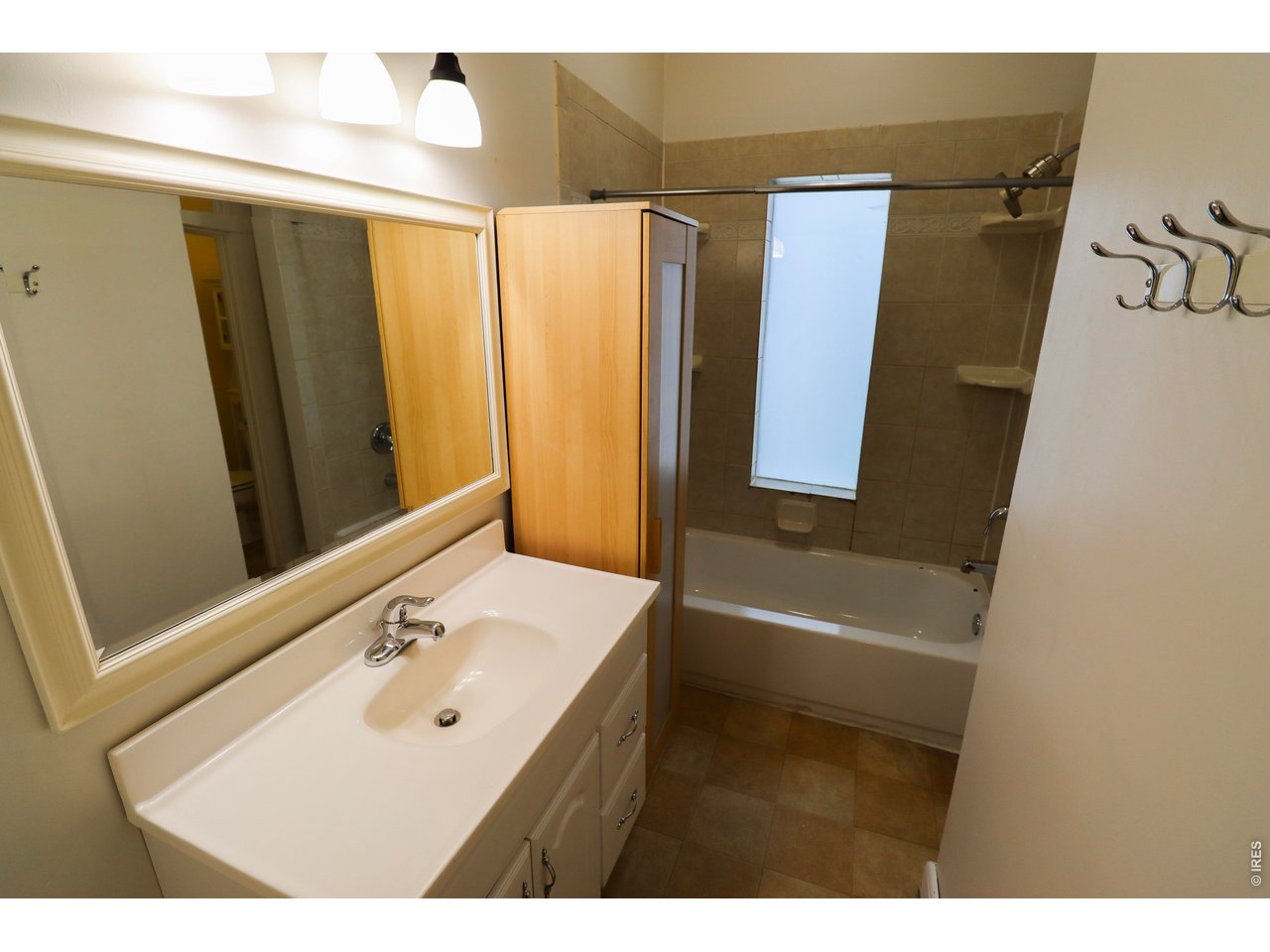 608 South Howes Street Fort Collins, CO 80521 - Photo 15 of 28 a bathroom with a sink mirror toilet and bathtub