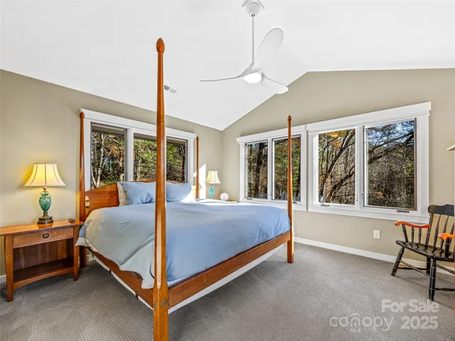 a bed sitting in a room next to a window