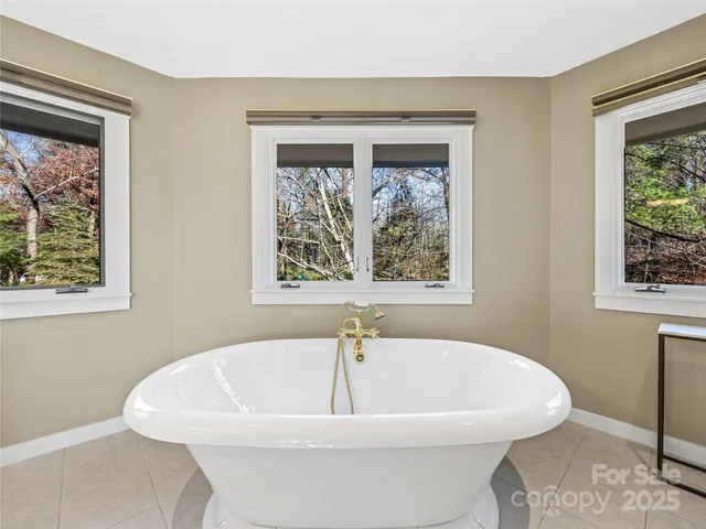 a white bath tub sitting in a bathroom