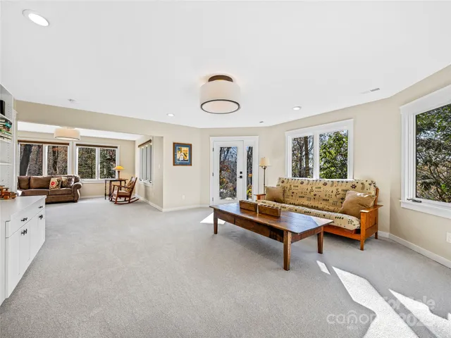 a living room with furniture and a window