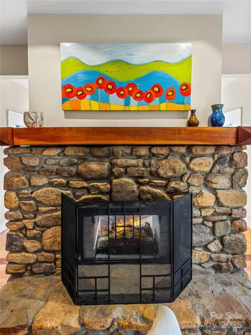 a room with storage and a wall painting