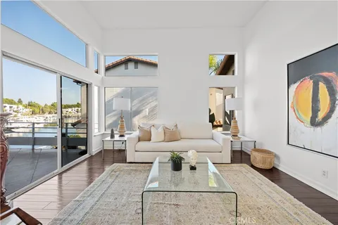 a kitchen with granite countertop a refrigerator and cabinets
