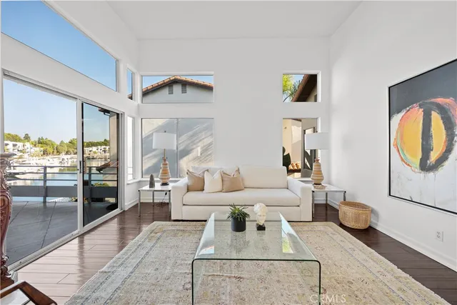 a kitchen with granite countertop a refrigerator and cabinets