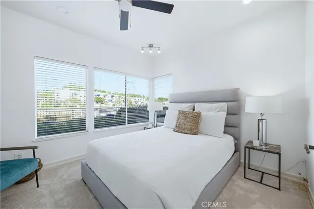 a view of a patio with couches and potted plants