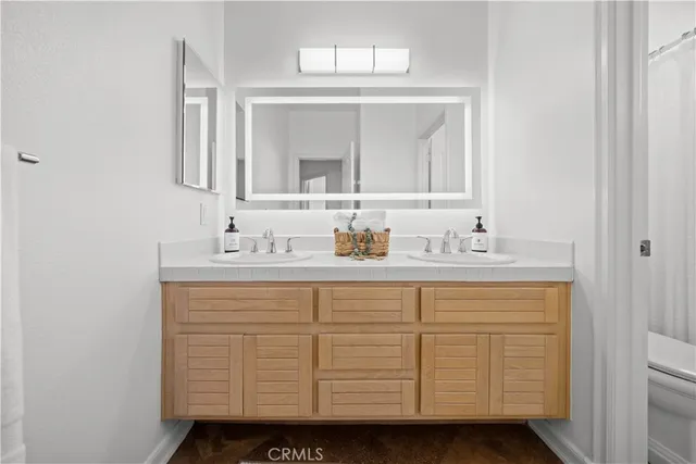 an aerial view of residential houses with outdoor space and river