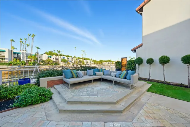 a view of a lake with boats and trees all around