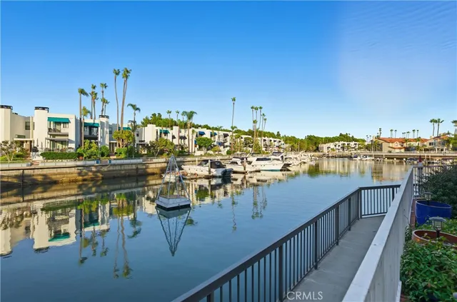 a view of a white house with a outdoor space