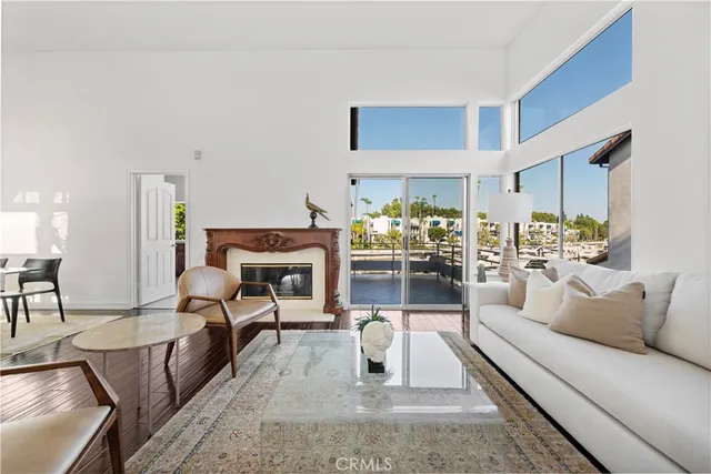 a living room with furniture and a painting on the wall