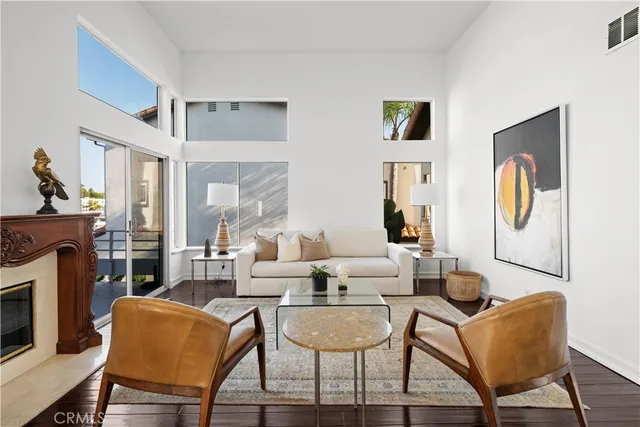 a view of a dining room with furniture and a chandelier