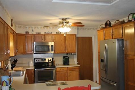 574 Sterrett Road Fairfield, VA 24435 - Photo 13 of 24 a kitchen with stainless steel appliances a stove refrigerator a sink and dishwasher