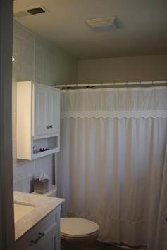 574 Sterrett Road Fairfield, VA 24435 - Photo 19 of 24 a bathroom with a sink a toilet and shower curtain