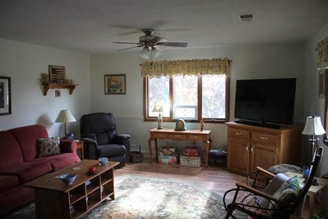 574 Sterrett Road Fairfield, VA 24435 - Photo 6 of 24 a living room with furniture a window and a flat screen tv