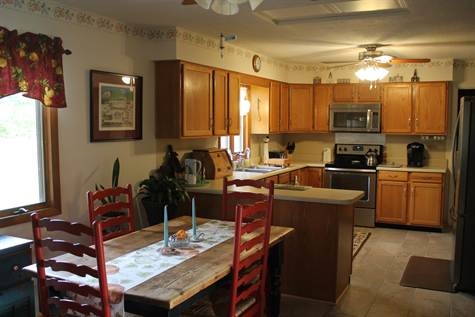 574 Sterrett Road Fairfield, VA 24435 - Photo 9 of 24 a kitchen with a sink stove and refrigerator