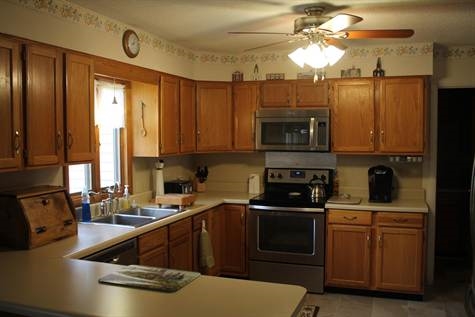 574 Sterrett Road Fairfield, VA 24435 - Photo 10 of 24 a kitchen with a sink a stove and cabinets