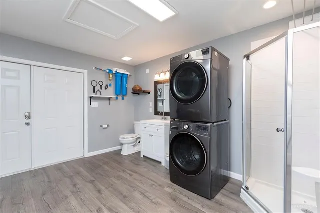 a view of a hallway with washer and dryer