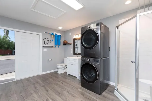 a view of a hallway with washer and dryer
