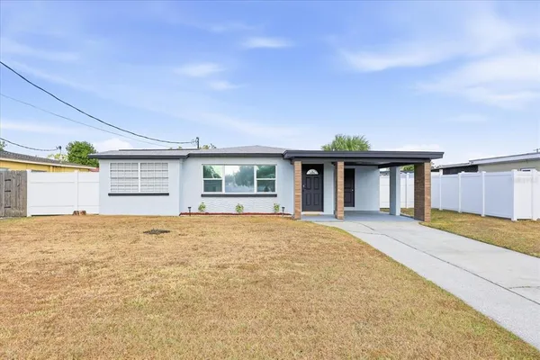a view of a house with a backyard and windows