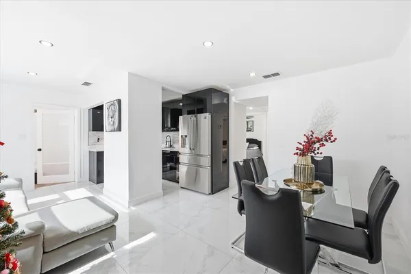 a view of a livingroom with furniture and a flat screen tv