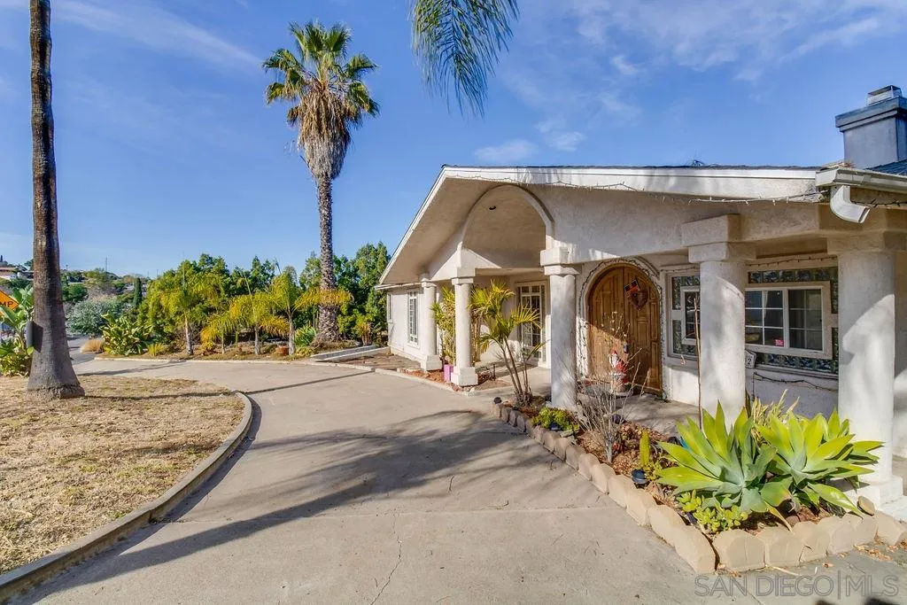 10302 Don Pico Road Spring Valley, CA 91978 - Photo 1 of 30 a view of a house with potted plants