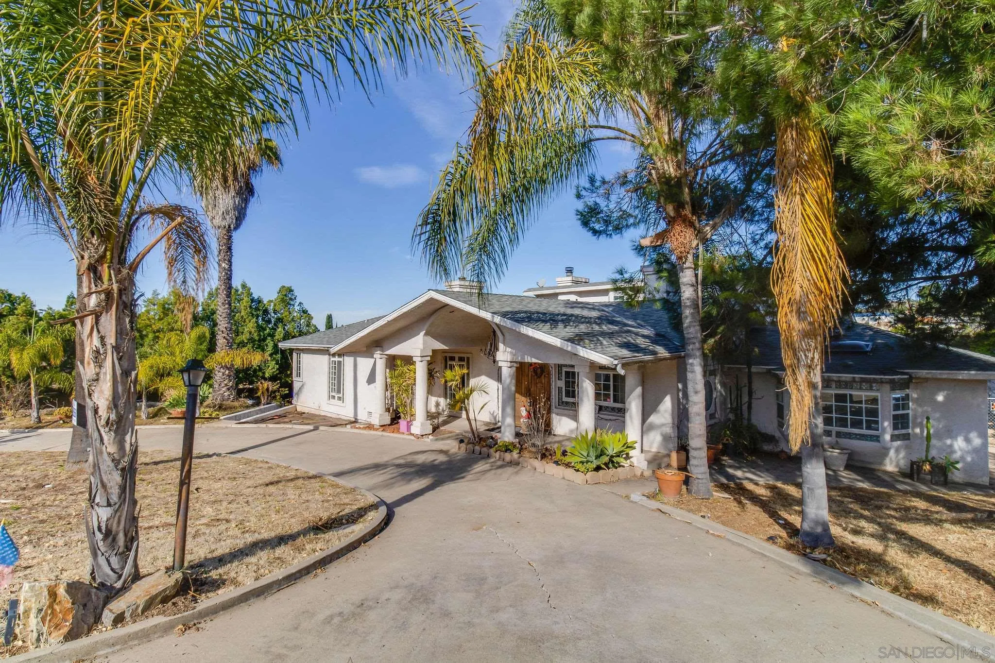 10302 Don Pico Road Spring Valley, CA 91978 - Photo 3 of 30 a front view of a house with a tree