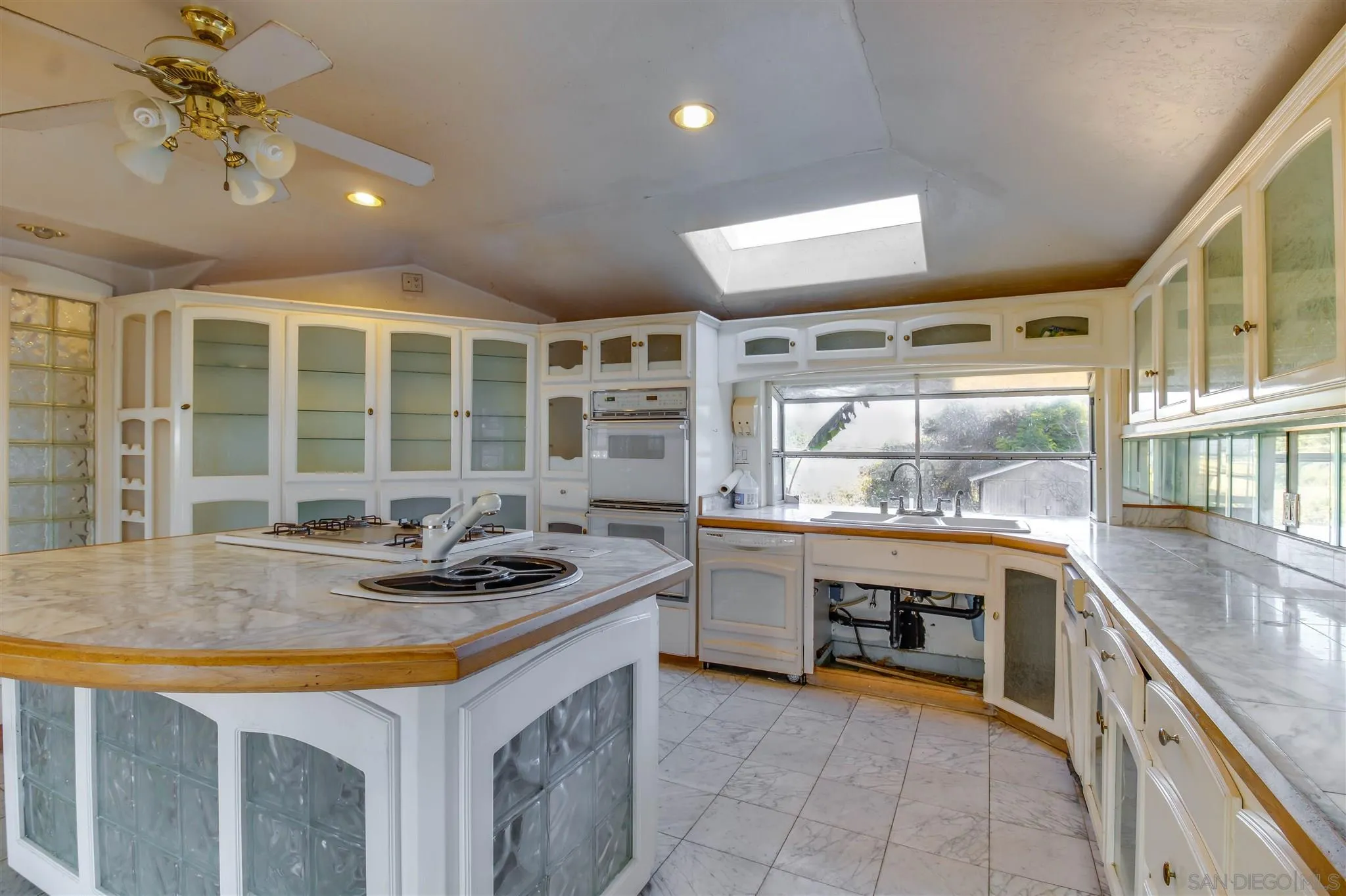 10302 Don Pico Road Spring Valley, CA 91978 - Photo 8 of 30 a kitchen with stainless steel appliances granite countertop a sink and cabinets