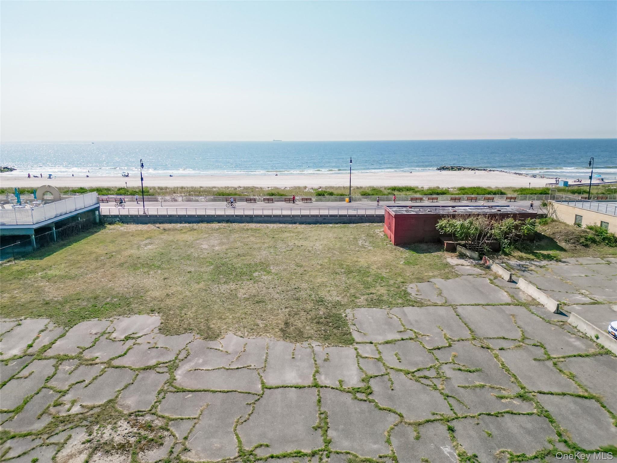 345 Shore Road, Unit 1E Long Beach, NY 11561 - Photo 13 of 13 a view of a lake with a terrace