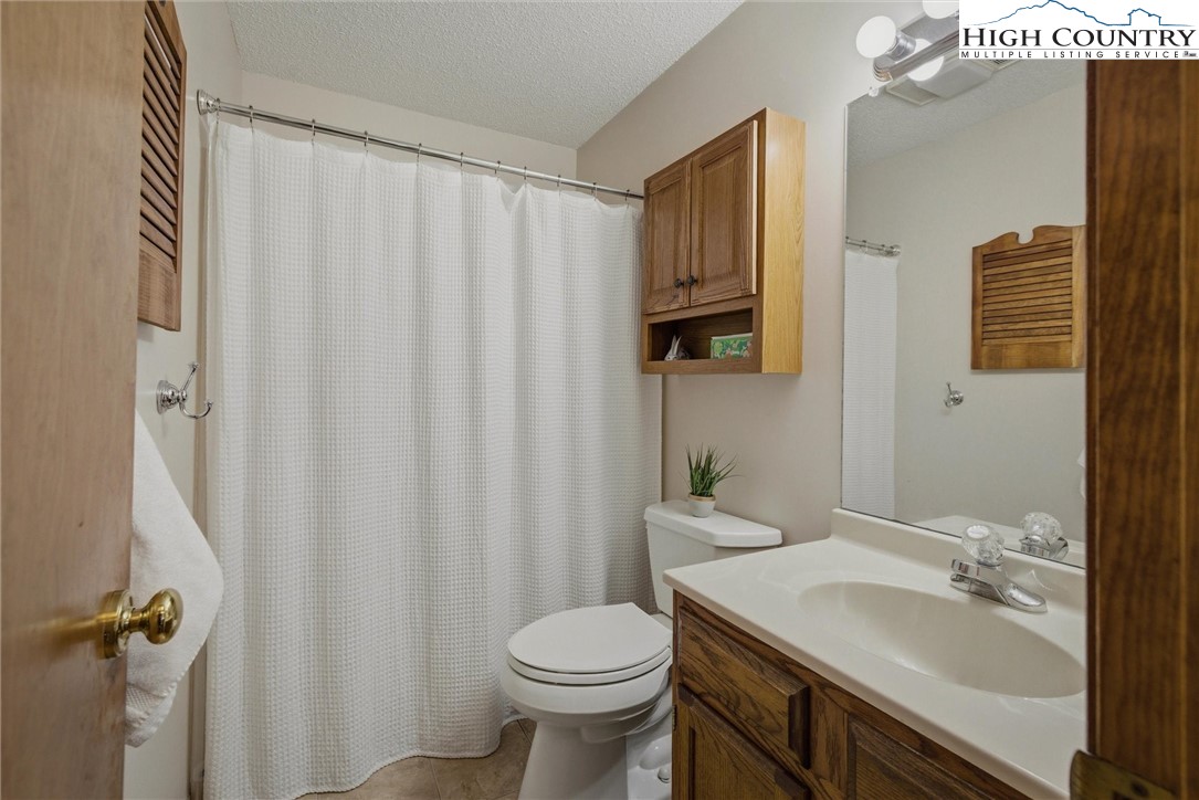 25 Poke Road Newland, NC 28657 - Photo 11 of 33 a bathroom with a sink toilet and shower