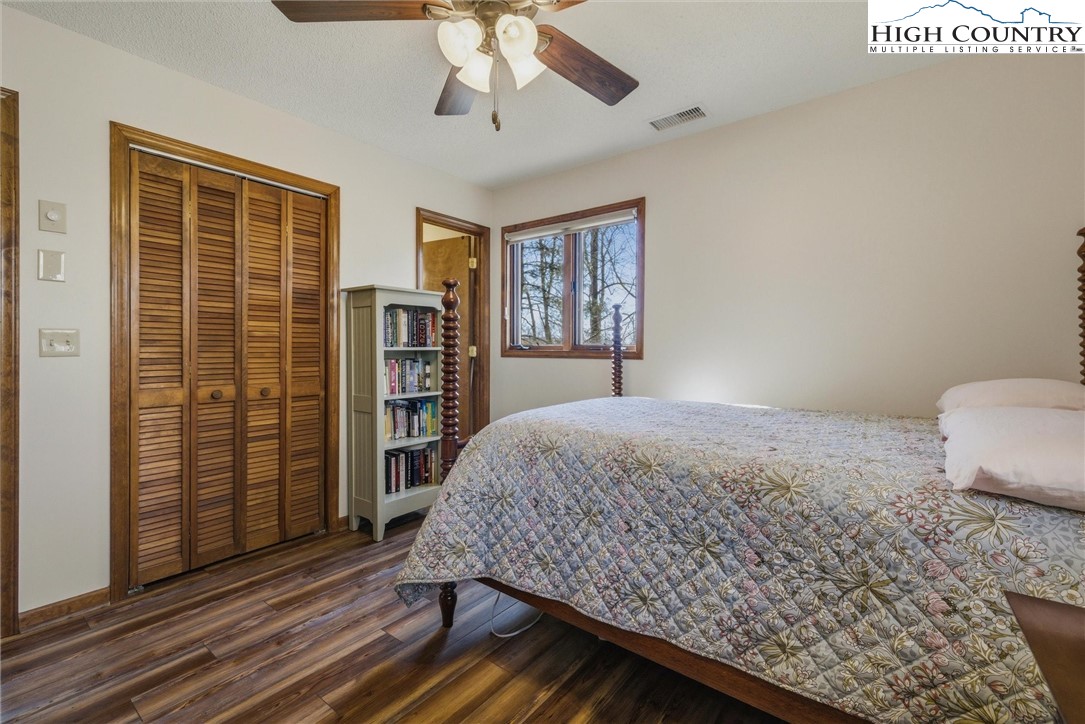 25 Poke Road Newland, NC 28657 - Photo 17 of 33 a bedroom with a bed and a book shelf