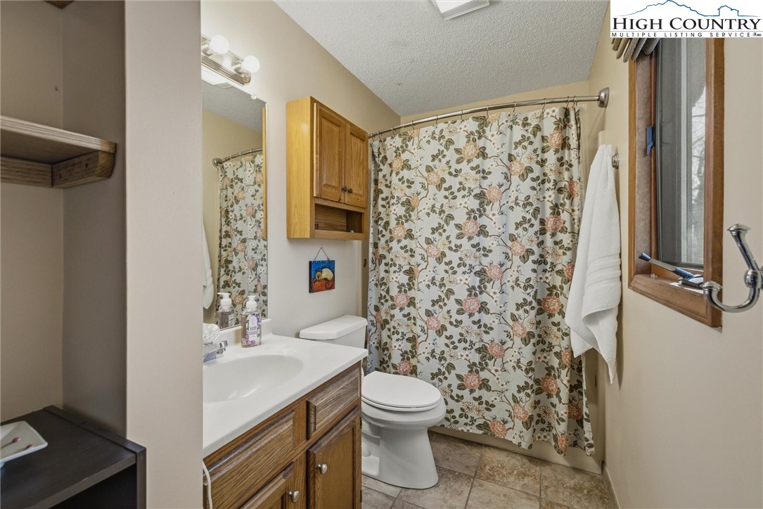 25 Poke Road Newland, NC 28657 - Photo 18 of 33 a bathroom with a sink toilet and shower