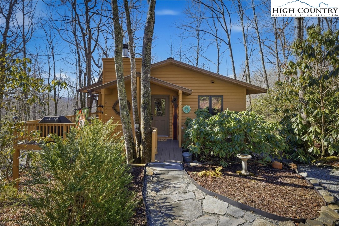 25 Poke Road Newland, NC 28657 - Photo 2 of 33 a view of a house with potted plants and large trees