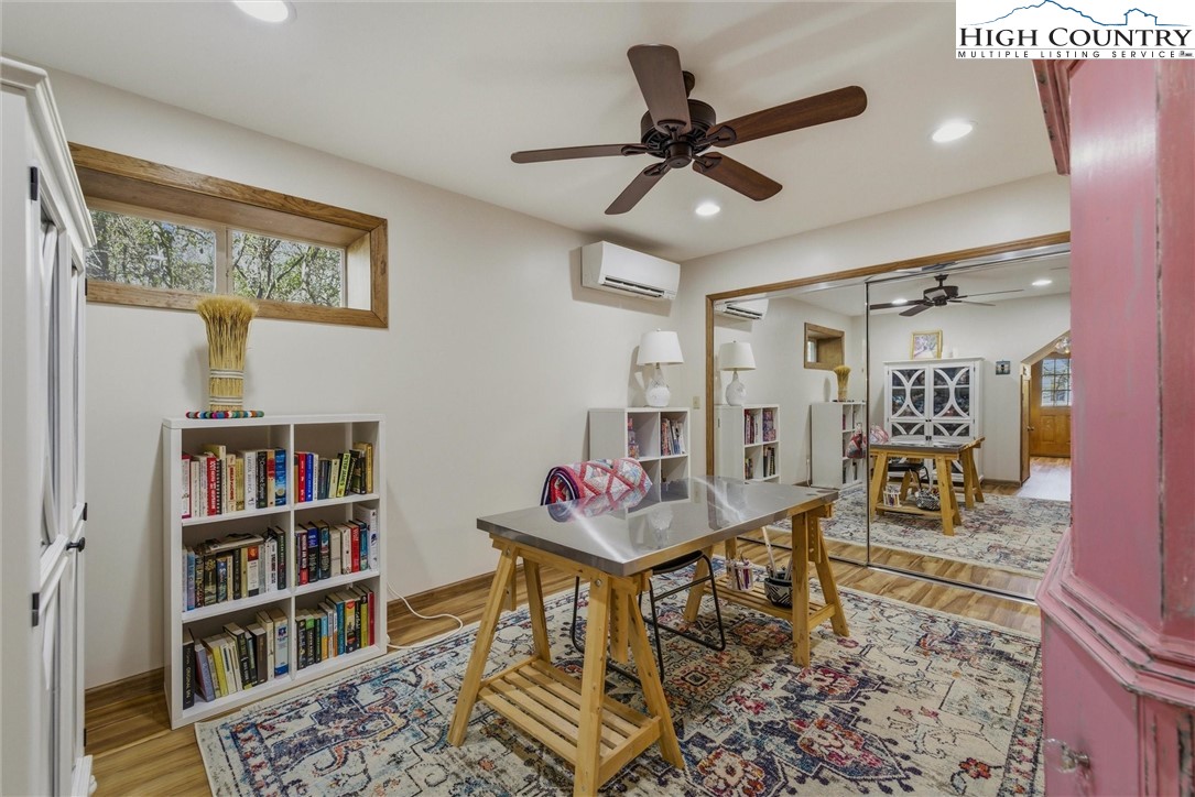 25 Poke Road Newland, NC 28657 - Photo 23 of 33 a living room with furniture and a book shelf