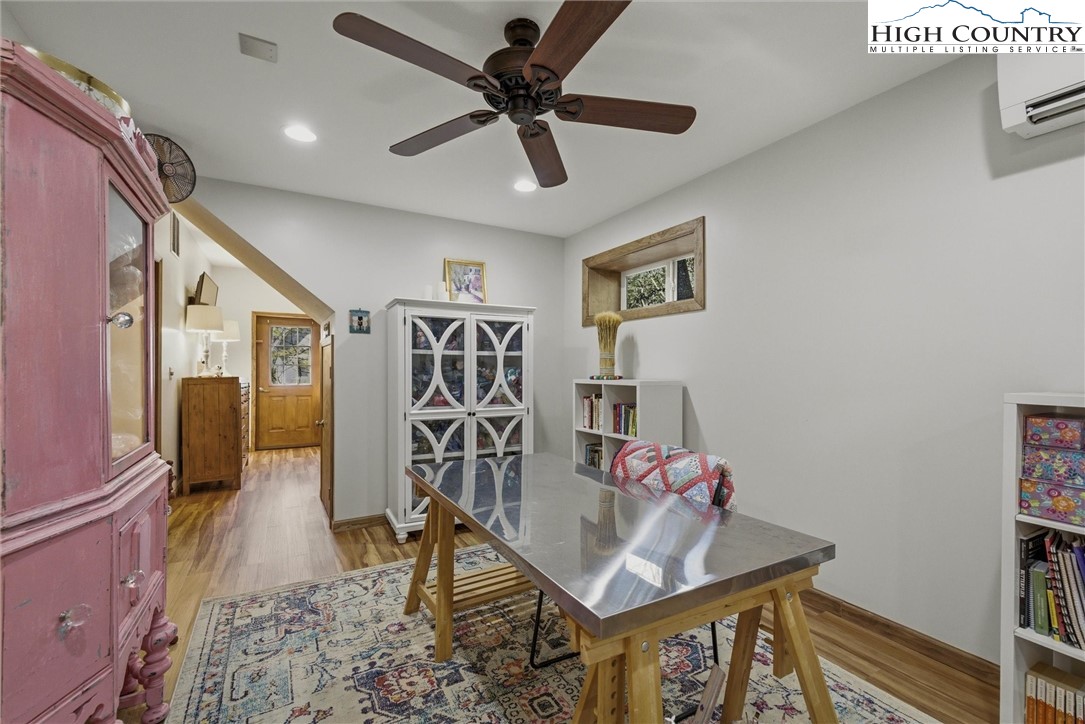 25 Poke Road Newland, NC 28657 - Photo 24 of 33 a very nice looking room with a dining table chairs with wooden floor