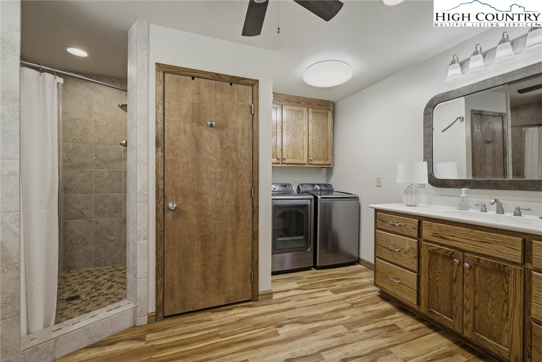 25 Poke Road Newland, NC 28657 - Photo 25 of 33 a spacious bathroom with a shower a sink and a mirror