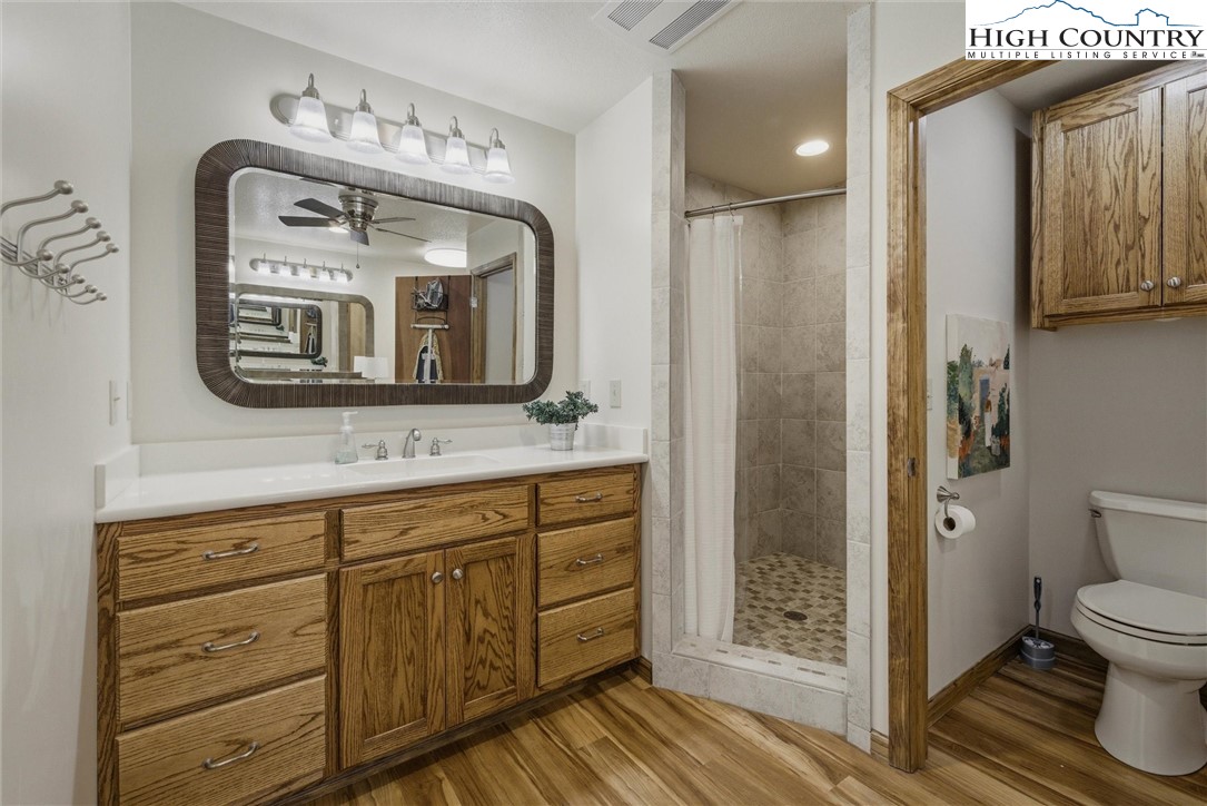 25 Poke Road Newland, NC 28657 - Photo 26 of 33 a bathroom with a toilet sink and mirror
