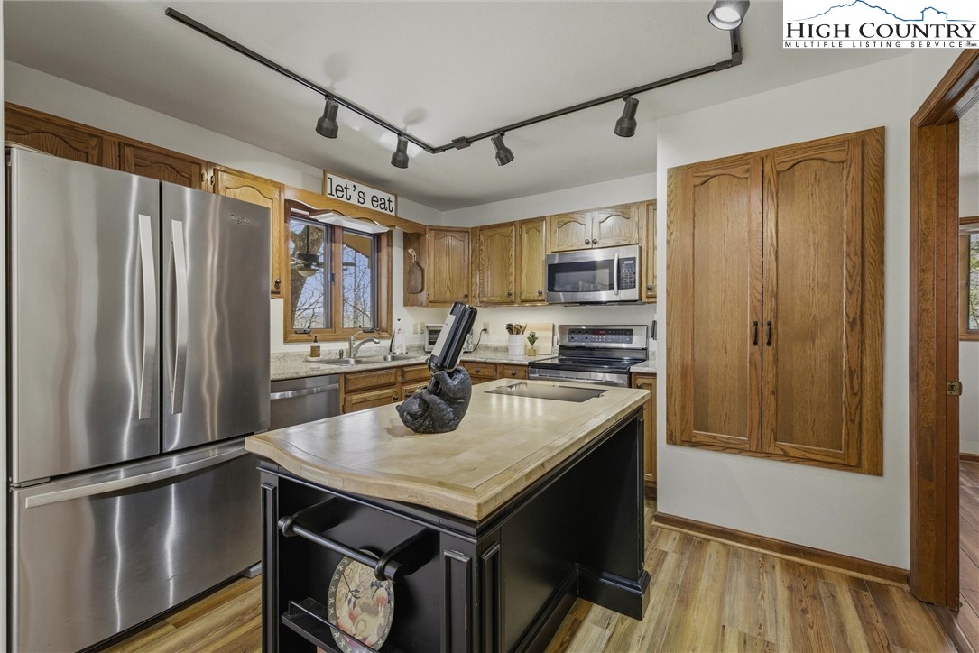 25 Poke Road Newland, NC 28657 - Photo 5 of 33 a kitchen with stainless steel appliances granite countertop a refrigerator a sink and a stove